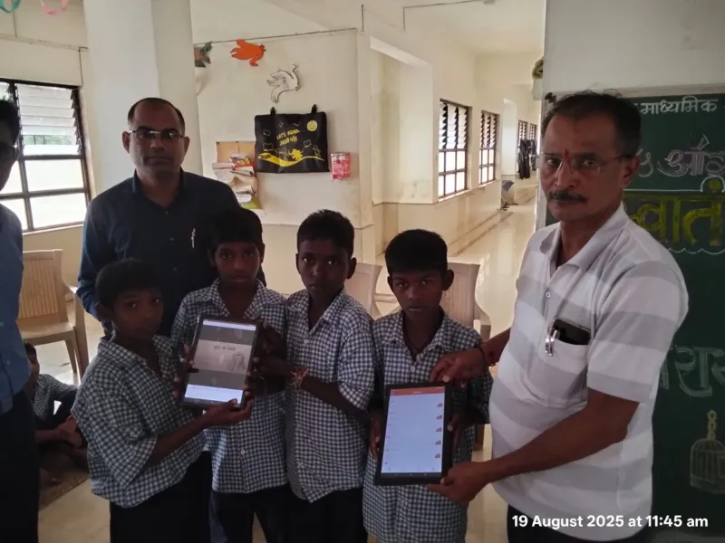 Students receiving EduSoulX tablets in their school